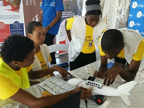 Students assembling an aircraft model during an Airbus programme session