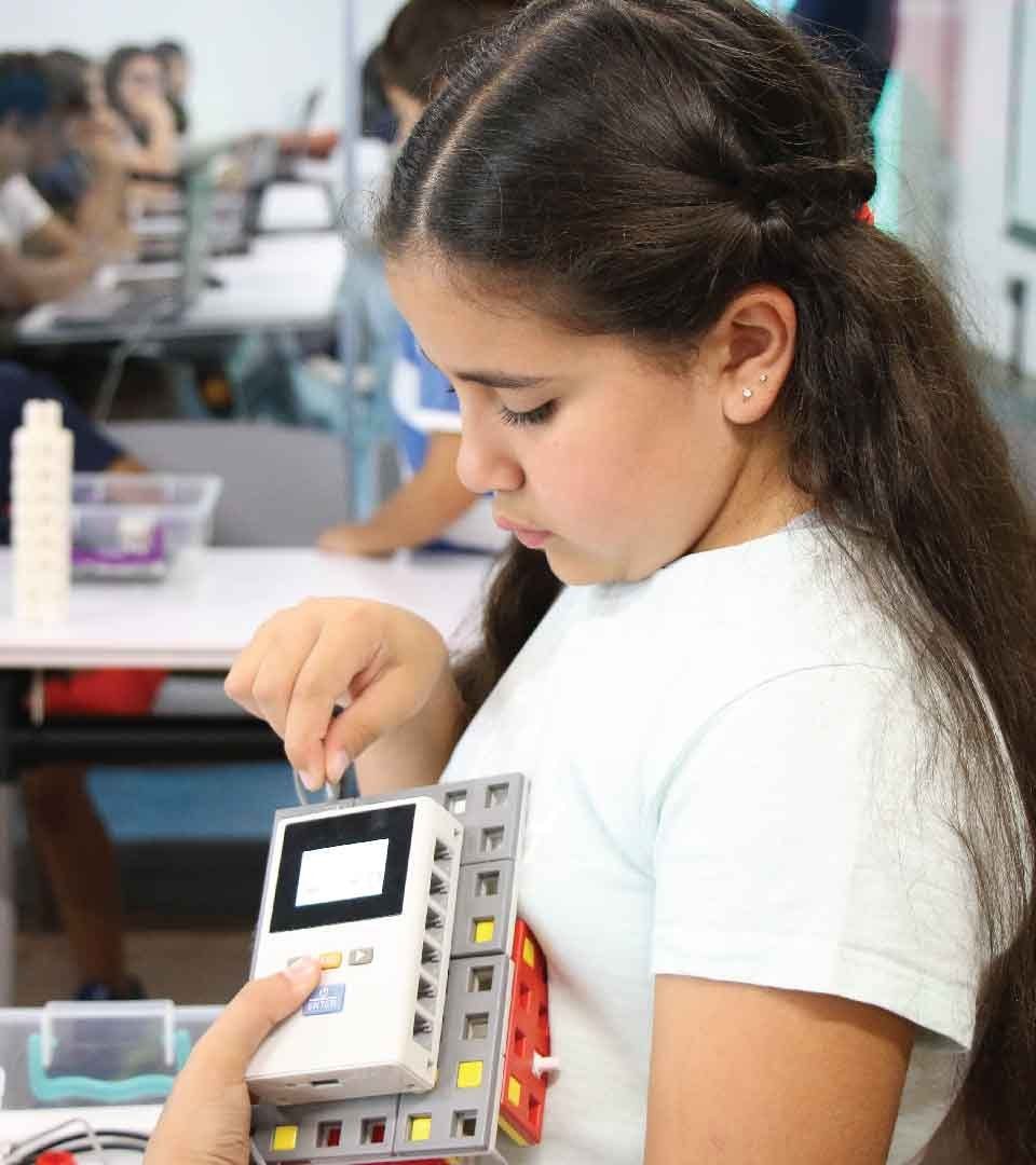 A student programming a robotics controller